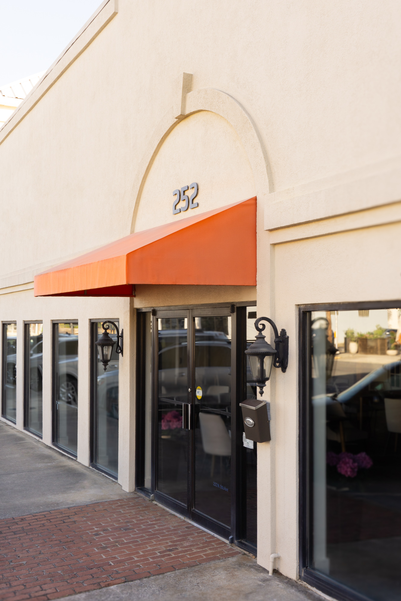 The orange awning at 252 N 5th Ave — look for this when you arrive