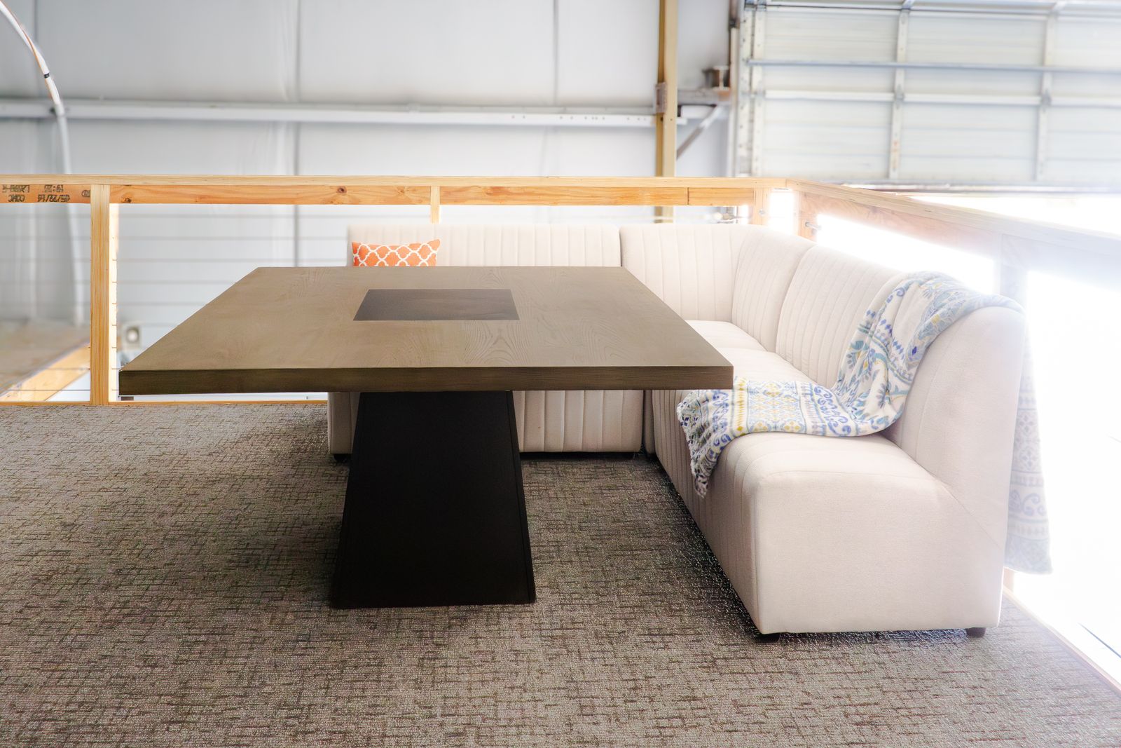 Long table with bench and sofa seating in the Loft