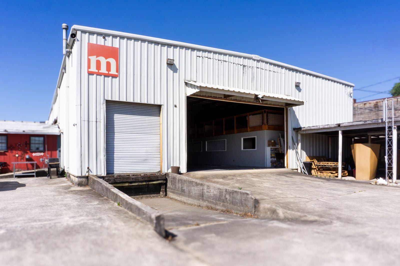 Side exterior view of the metal event building and grounds